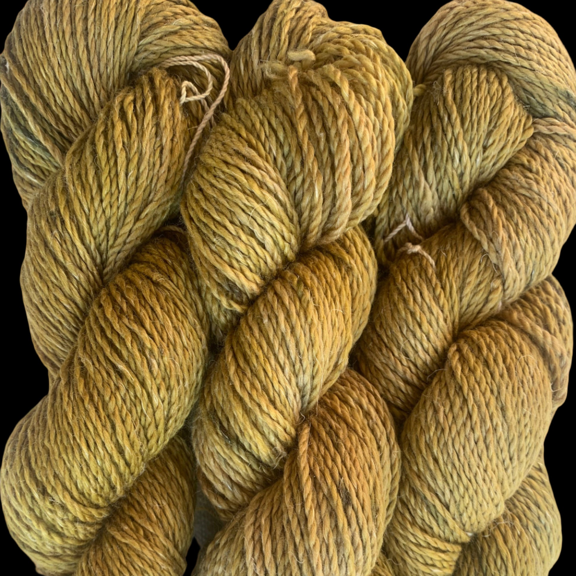 Khaki yellow merino linen skein with brown speckles