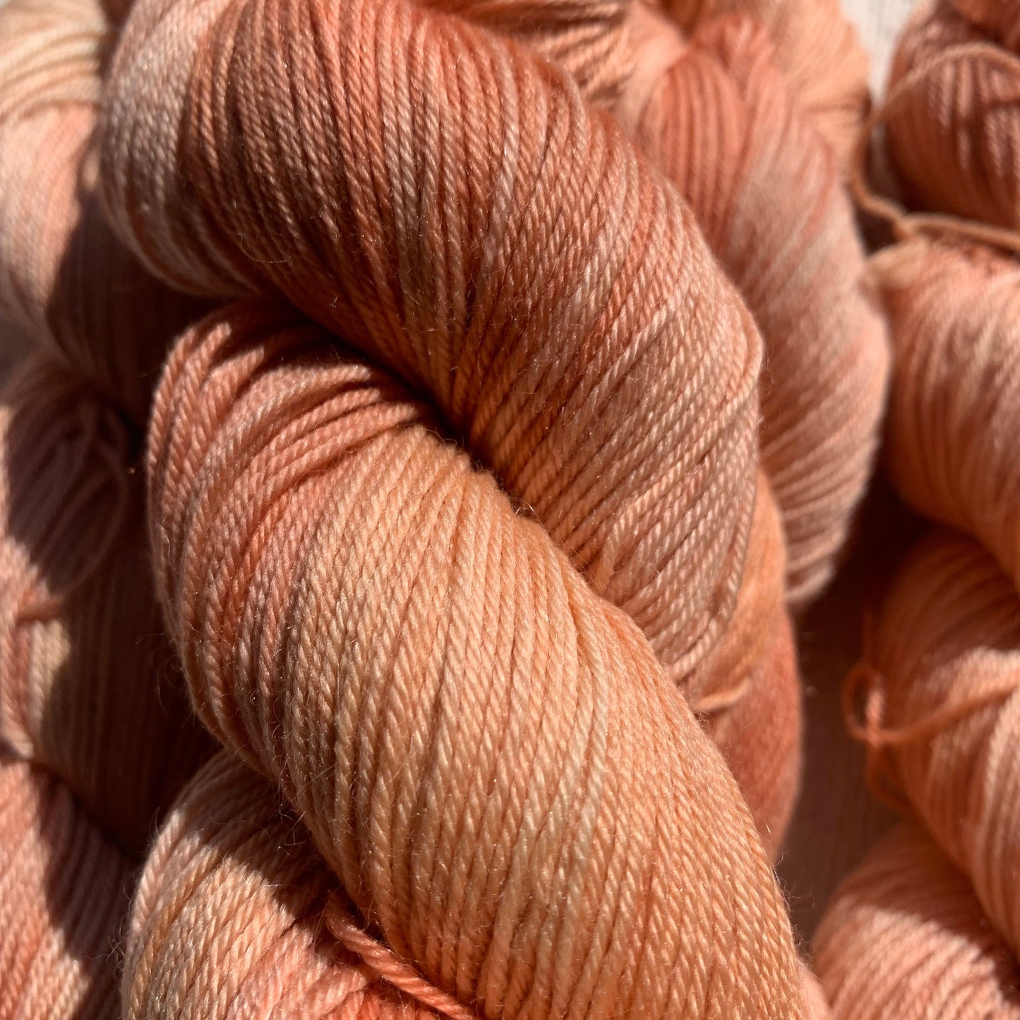 Bright orange variegated skein of sock yarn